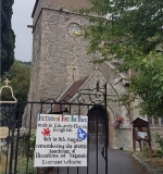 Knighton church sign on gate